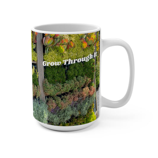 Mug with nature-themed design and 'Grow Through It' text on a white background